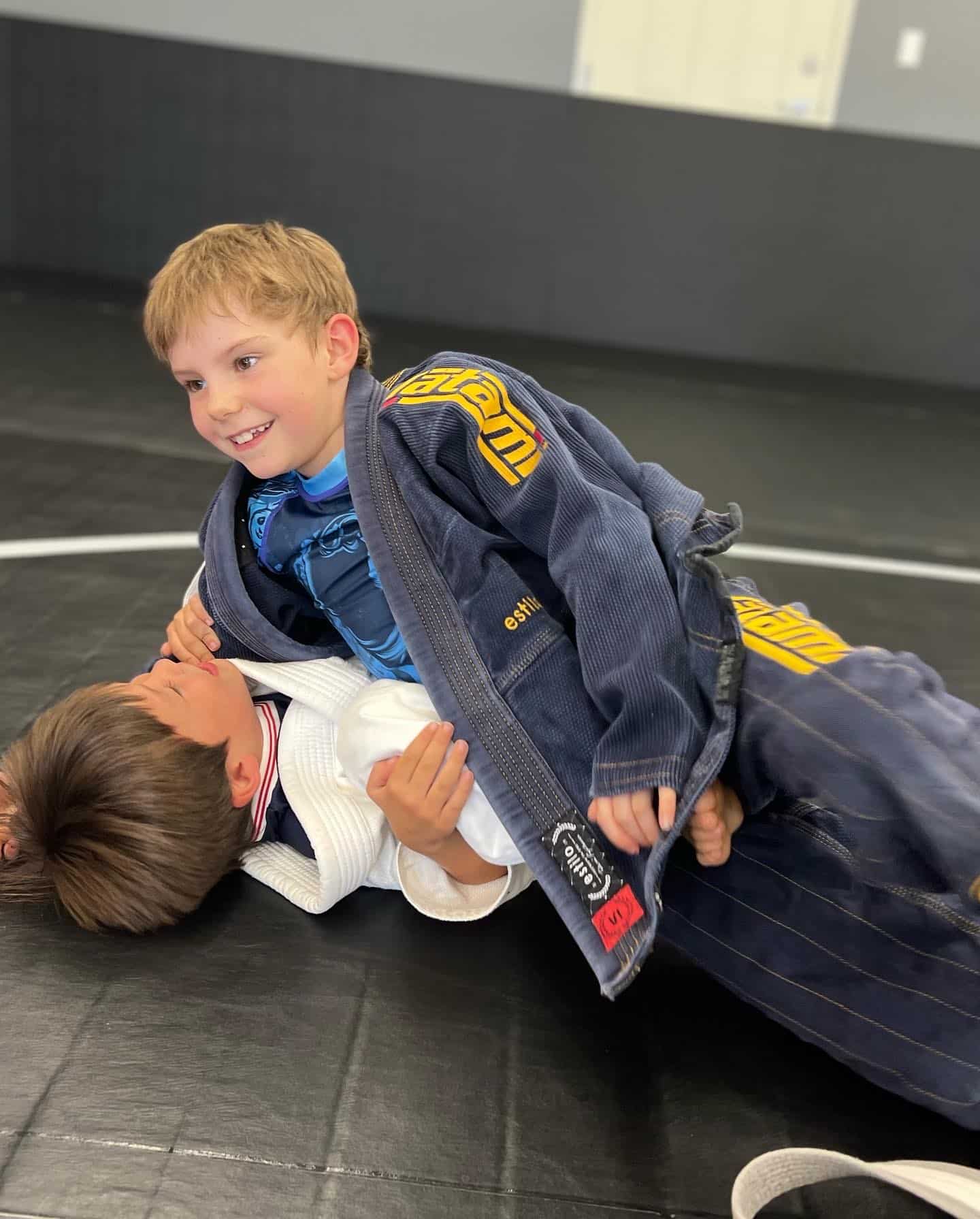 Elevated Martial Arts Students Kids in gi Grappling
